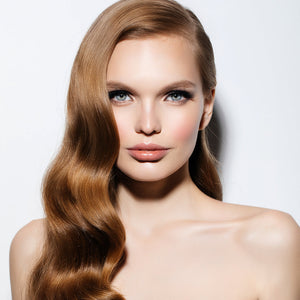 A person with long, straight, brown hair, likely a model showcasing the hair extension product.