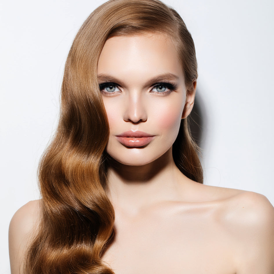 A person with long, straight, brown hair, likely a model showcasing the hair extension product.